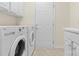 Laundry room with washer, dryer, and cabinets at 15331 Legend Oaks Ct, Fort Mill, SC 29707