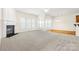 Living room with hardwood floors and a view to the kitchen at 15331 Legend Oaks Ct, Fort Mill, SC 29707