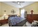 Bedroom with hardwood floors, ceiling fan, and built-in shelving at 16287 Raven Crest Dr, Fort Mill, SC 29707