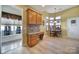 Bright breakfast nook with built-in desk and wood table and chairs at 16287 Raven Crest Dr, Fort Mill, SC 29707