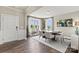 Bright dining room with hardwood floors and large windows at 208 Coronado Ave # 47, Matthews, NC 28104