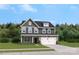 Two-story home with gray siding, white trim, and a two-car garage at 208 Coronado Ave # 47, Matthews, NC 28104