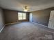 Spacious bedroom with neutral walls and plush carpeting at 2308 Grayson Pkwy, Monroe, NC 28110