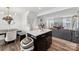 A kitchen with dark cabinets, stainless appliances, and an island at 2409 Fathom Way, Charlotte, NC 28269