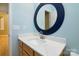 Bathroom with vanity, large mirror, and light blue walls at 2534 Old Ashworth Nw Ln, Concord, NC 28027