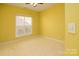 Bright bedroom with neutral carpeting and window at 2534 Old Ashworth Nw Ln, Concord, NC 28027