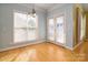 Breakfast nook with hardwood floors, french doors, and light walls at 2534 Old Ashworth Nw Ln, Concord, NC 28027