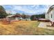 Landscaped backyard with a shed and patio at 2945 Parks Lafferty Rd, Concord, NC 28025