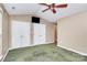 Bright bedroom featuring a ceiling fan and double door closets at 2945 Parks Lafferty Rd, Concord, NC 28025