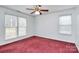 Well-lit bedroom with neutral walls and carpet at 2945 Parks Lafferty Rd, Concord, NC 28025