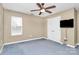 Bedroom with ceiling fan, carpet, and double door closet at 2945 Parks Lafferty Rd, Concord, NC 28025