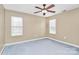 Spacious bedroom with ceiling fan and carpet at 2945 Parks Lafferty Rd, Concord, NC 28025