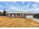 Brick ranch house with a green metal roof and attached garage at 2945 Parks Lafferty Rd, Concord, NC 28025