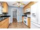 Kitchen with light wood cabinets, granite counters, and updated appliances at 2945 Parks Lafferty Rd, Concord, NC 28025