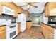 Bright kitchen with wood cabinets, granite countertops, and white appliances at 2945 Parks Lafferty Rd, Concord, NC 28025