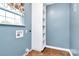 Laundry room with built-in shelving and tile floor at 2945 Parks Lafferty Rd, Concord, NC 28025