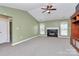 Living room with vaulted ceiling, fireplace and carpet at 2945 Parks Lafferty Rd, Concord, NC 28025