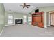 Spacious living room featuring a fireplace and built-in shelving at 2945 Parks Lafferty Rd, Concord, NC 28025