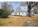 White house with a yard and trees in the background at 429 Hill St, Statesville, NC 28677