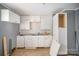 White cabinets, double sink, and wood floor at 429 Hill St, Statesville, NC 28677