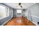 Living room with hardwood floors, ceiling fan, and window at 429 Hill St, Statesville, NC 28677