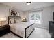 Spacious bedroom with large windows and neutral decor at 4419 Woodlark Ln, Charlotte, NC 28211