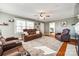 Living room with hardwood floors, fireplace, and recessed lighting at 708 N Main St, Lowell, NC 28098