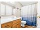 Bathroom with single sink vanity, shower/tub combo, and wood floor at 102 Caribou Dr, Statesville, NC 28625