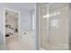 Bathroom with soaking tub, shower, and view of bedroom at 11131 Cypress View Dr, Charlotte, NC 28262