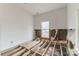 Unfinished bedroom with exposed subfloor and insulation at 1119 Poplar St, Albemarle, NC 28001