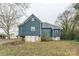 Rear view of a blue house under renovation, raised foundation at 1119 Poplar St, Albemarle, NC 28001