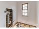 Unfinished laundry room with plumbing and window at 1119 Poplar St, Albemarle, NC 28001