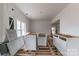 Under construction living room with new cabinets and flooring at 1119 Poplar St, Albemarle, NC 28001