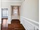 Bright entryway with dark wood floors and white wainscoting at 1121 Eddisbury Cv, Waxhaw, NC 28173