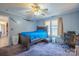 Cozy bedroom with a ceiling fan, workspace and large windows at 125 Rocky Pt, Cleveland, NC 27013