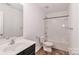 Clean bathroom with tub, toilet and vanity at 136 Quail Springs Rd, Statesville, NC 28677