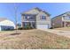 Two-story house with attached garage and manicured lawn at 136 Quail Springs Rd, Statesville, NC 28677