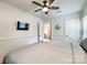 Serene bedroom with a mounted TV and ceiling fan at 1720 Pecan Ave, Charlotte, NC 28205