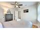 Bright bedroom with a dresser, TV and comfortable bedding at 1720 Pecan Ave, Charlotte, NC 28205