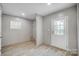 Bright laundry room with wood-look floors and exterior access at 1860 Bascom Ln, Midland, NC 28107