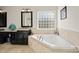 Elegant bathroom with a soaking tub, double vanity, and tile flooring at 209 9Th Ne St, Conover, NC 28613