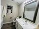 Bathroom with white vanity and a large mirror at 2225 Southwind Dr, Charlotte, NC 28216