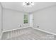 Bright bedroom with gray walls and carpet at 2225 Southwind Dr, Charlotte, NC 28216