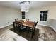 Elegant dining room with a dark wood table and chandelier at 2225 Southwind Dr, Charlotte, NC 28216