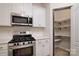 Stainless steel range and microwave in modern kitchen at 292 Ascot Run Way, Fort Mill, SC 29715