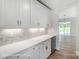 Kitchen wet bar with white shaker cabinets and wine cooler at 3252 Mcharney Dr # 37, Harrisburg, NC 28075