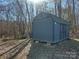 Large gray barn-style shed in wooded area at 344 Fletcher Rd, Union Grove, NC 28689