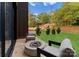 Cozy patio with fire pit and seating area, overlooking a grassy yard at 4026 Chevington Rd # 102, Charlotte, NC 28226