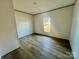 Bright bedroom featuring a window and laminate floors at 46 Kidd And Brown Rd, Hiddenite, NC 28636