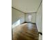 Simple bedroom with laminate flooring and a window at 46 Kidd And Brown Rd, Hiddenite, NC 28636